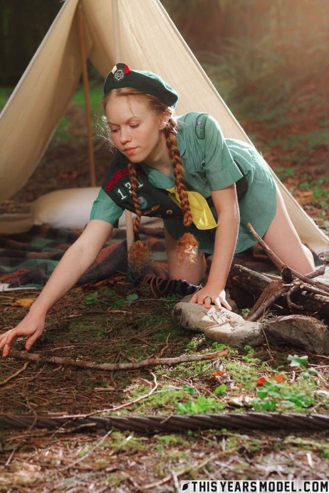 Redheaded Girl Scout Dolly Little gets naked outside her tent in beret | Photo: 198636