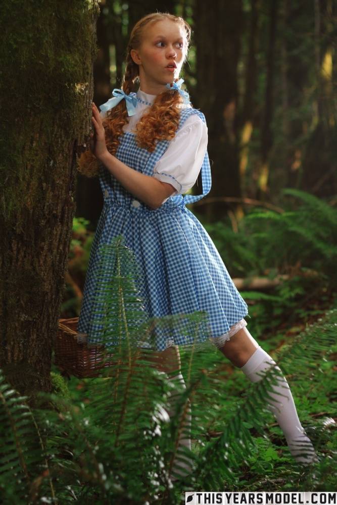 Charming redhead teen Dolly Little gets naked in white socks while in a forest - #4