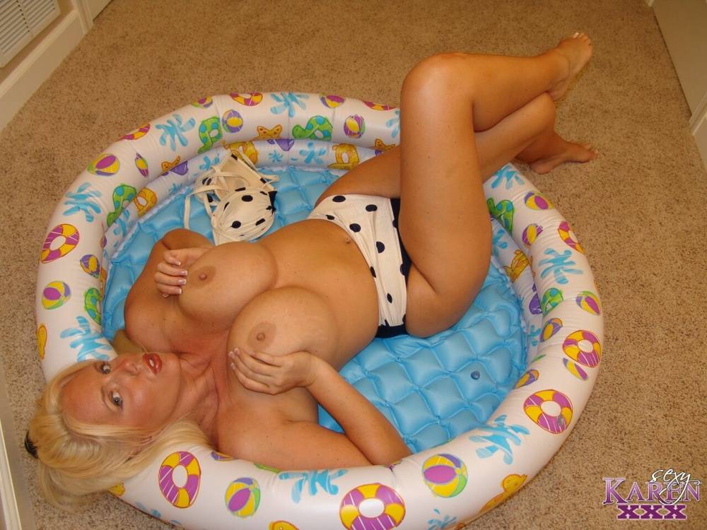 Blonde MILF Karen Fisher frees her fake tits from a bikini in a child's pool - #3