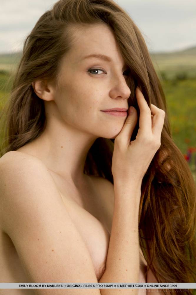 Long haired teen Emily Bloom slips off a dress to model naked in a field - #2