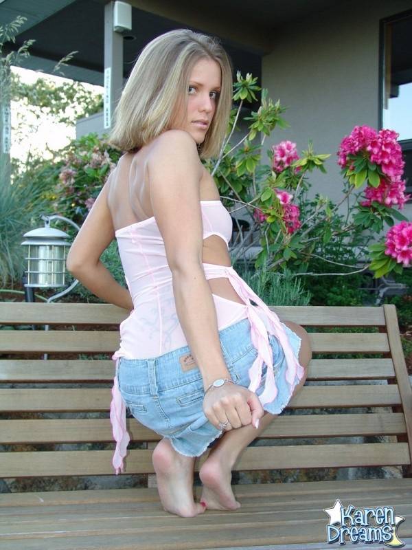 Blonde teen Karen exposes her upskirt panties on a garden bench - #1