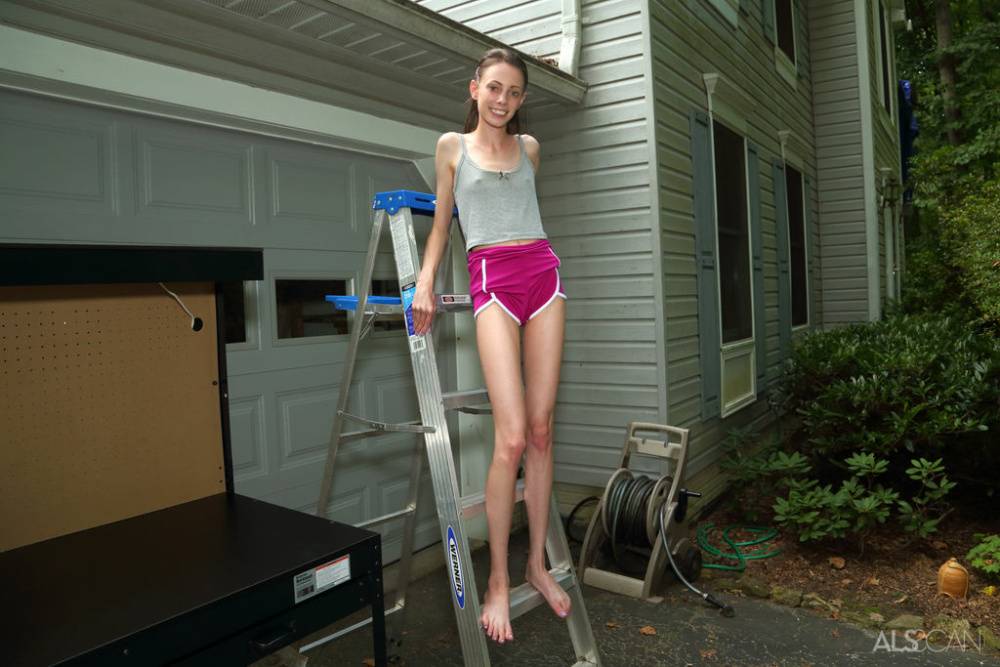 Skinny teen Aria Haze gets totally naked on a workbench out in a driveway - #8