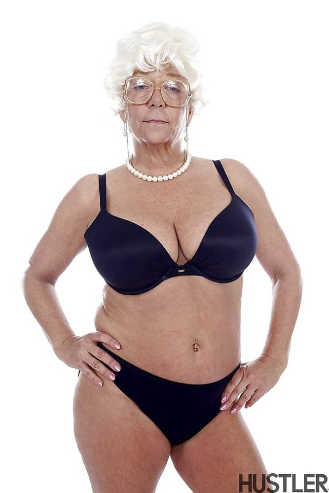 Granny pornstar Karen Summer modelling fully clothed before stripping naked - #9