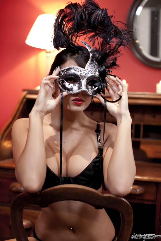 Brunette girl in her bra and underwear dons a mask to match her girlfriend | Photo: 668233