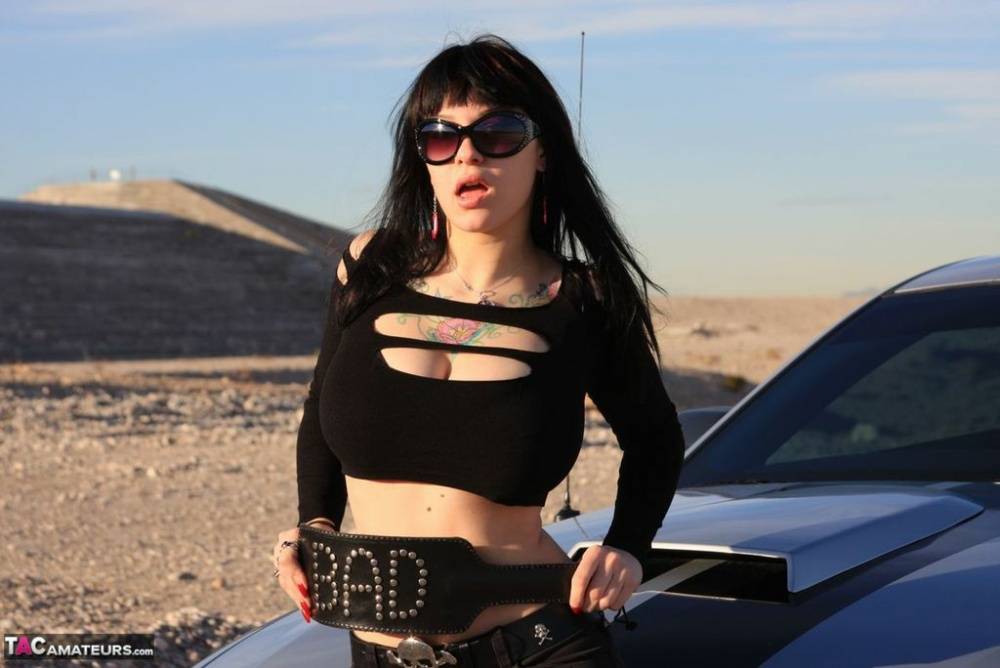 Sexy chick Susy Rocks exposes her bra over the hood of a car in shades - #16