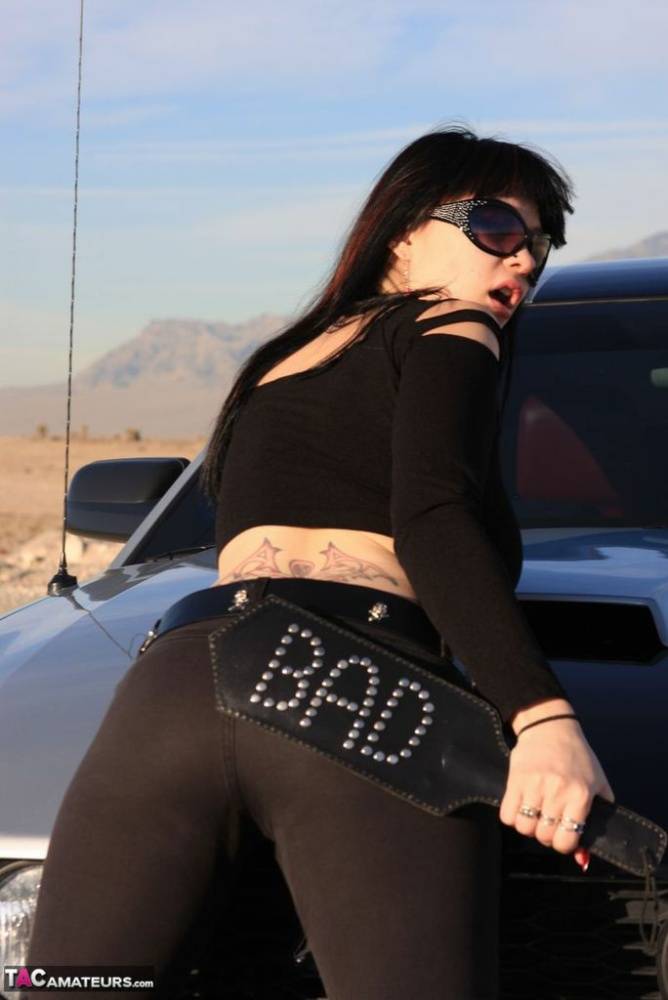 Sexy chick Susy Rocks exposes her bra over the hood of a car in shades - #13