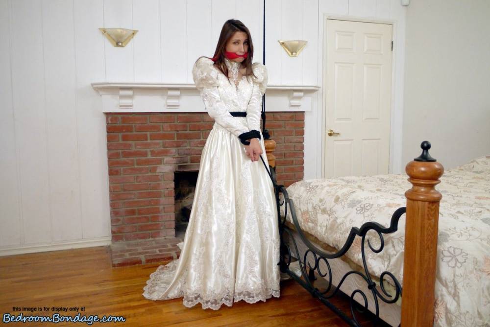 Brunette bride Celeste Star is ballgagged and tied up in her wedding dress - #15