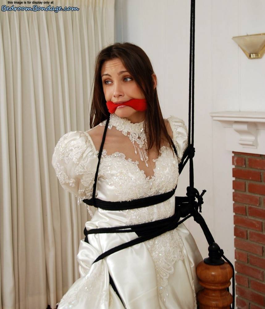 Brunette bride Celeste Star is ballgagged and tied up in her wedding dress - #8