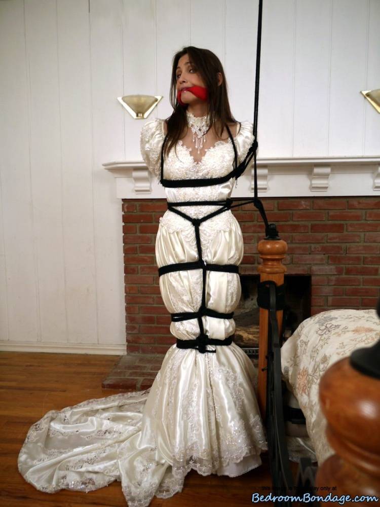 Brunette bride Celeste Star is ballgagged and tied up in her wedding dress - #12