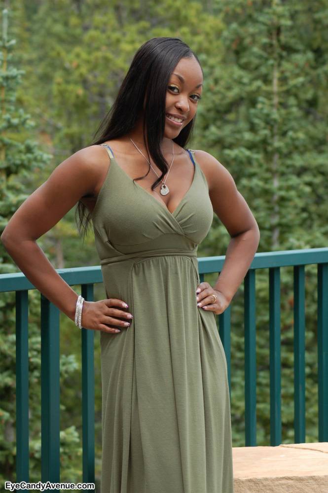 Ebony amateur Amber releases her big tits from a long dress on a balcony - #7