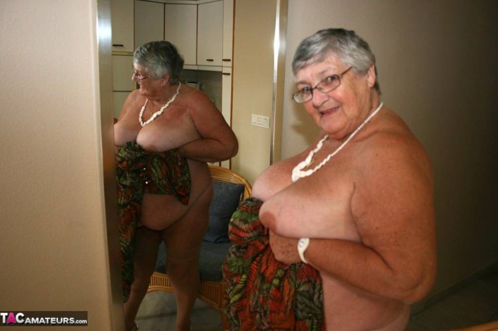 Silver haired granny Grandma Libby exposes her obese figure afore a mirror - #1