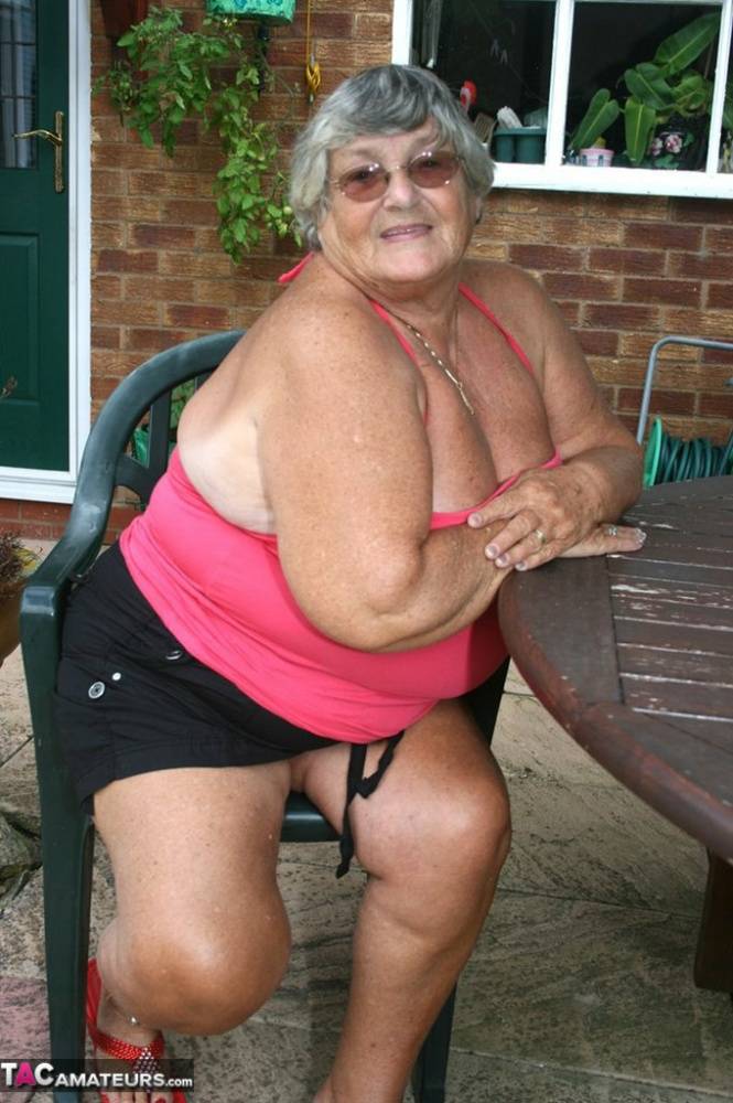 Fat oma Grandma Libby licks a nipple before baring her big ass on a patio | Photo: 732880