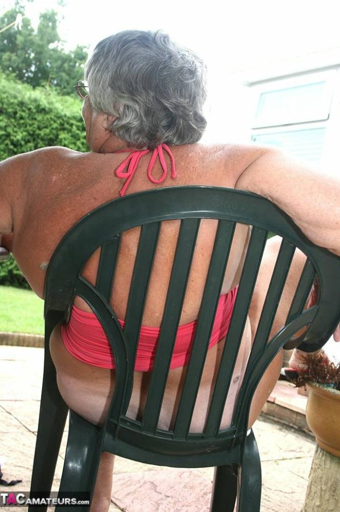 Fat oma Grandma Libby licks a nipple before baring her big ass on a patio | Photo: 732856