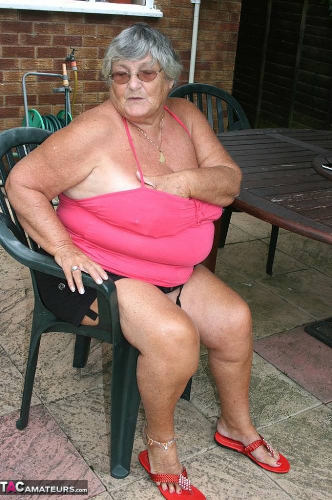 Fat oma Grandma Libby licks a nipple before baring her big ass on a patio | Photo: 732864