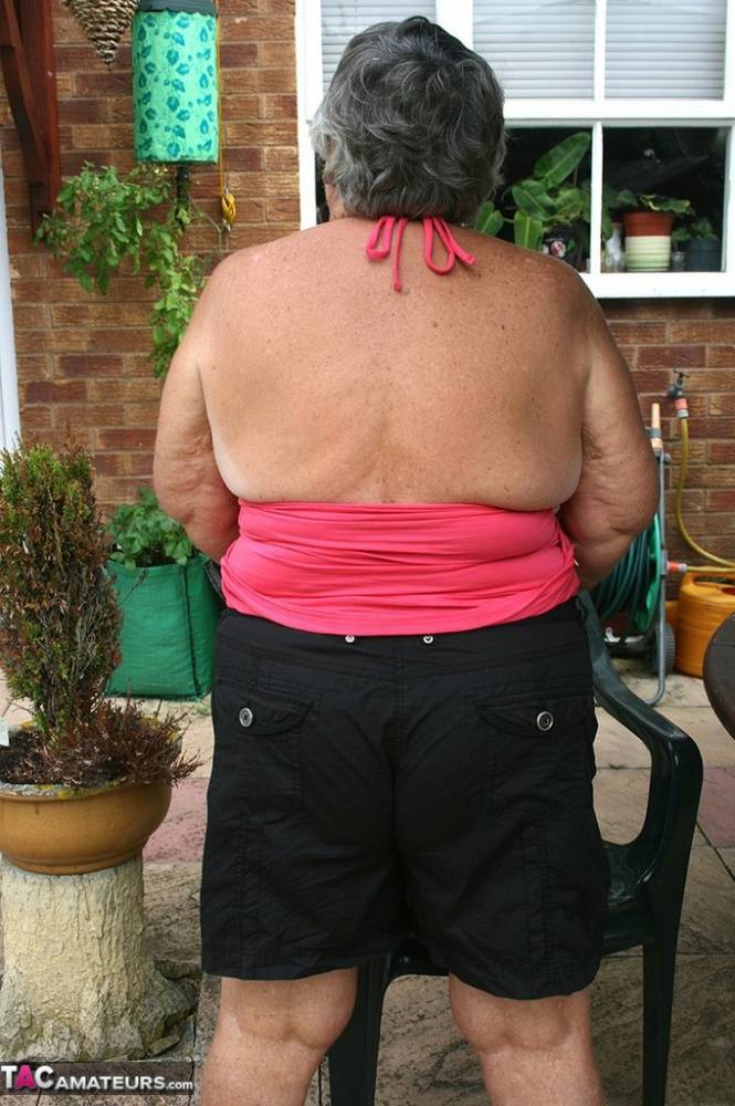 Fat oma Grandma Libby licks a nipple before baring her big ass on a patio | Photo: 732870