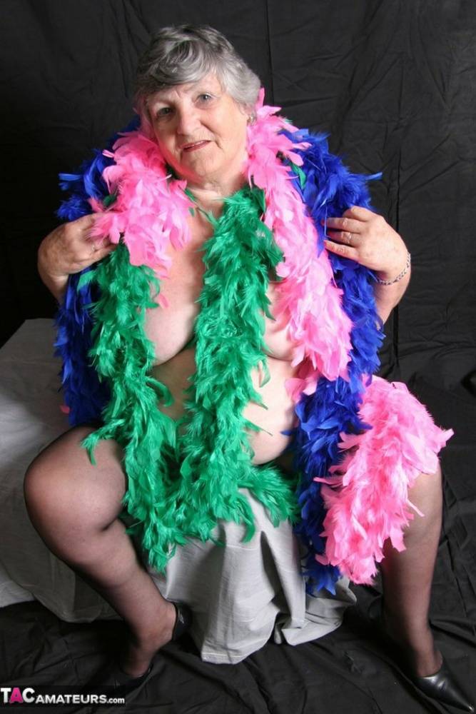 Fat UK amateur Grandma Libby shows her big tits while draped in feather boas - #1