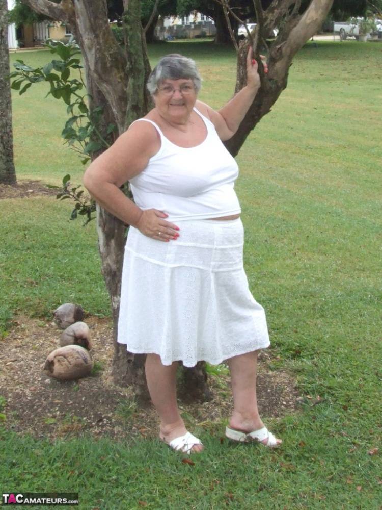 Obese British lady Grandma Libby exposes her large tits underneath a tree - #9