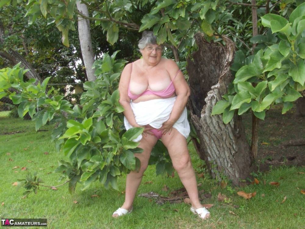Obese British lady Grandma Libby exposes her large tits underneath a tree - #15