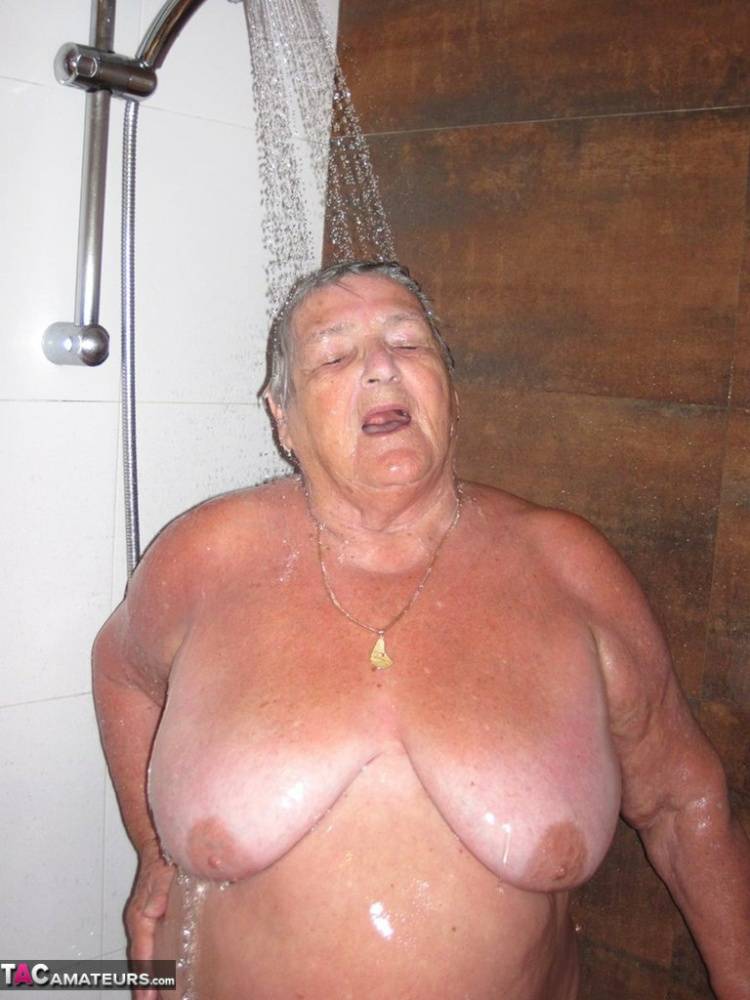 Obese amateur Grandma Libby blow drys her hair after taking a shower | Photo: 791839