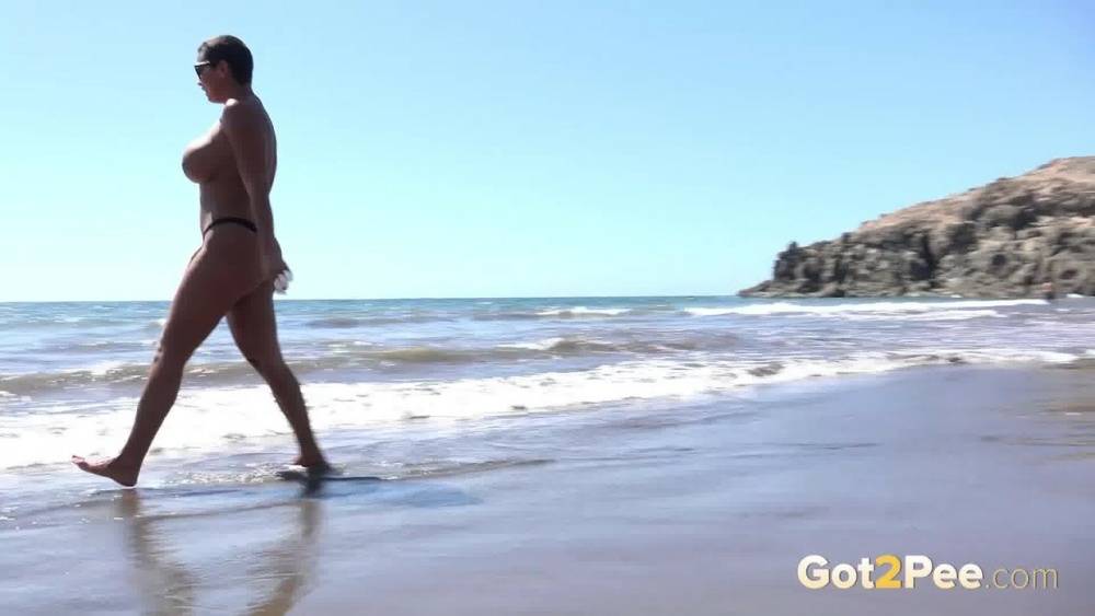Big titted woman Chloe Lamour squats for a pee while walking on a beach - #10