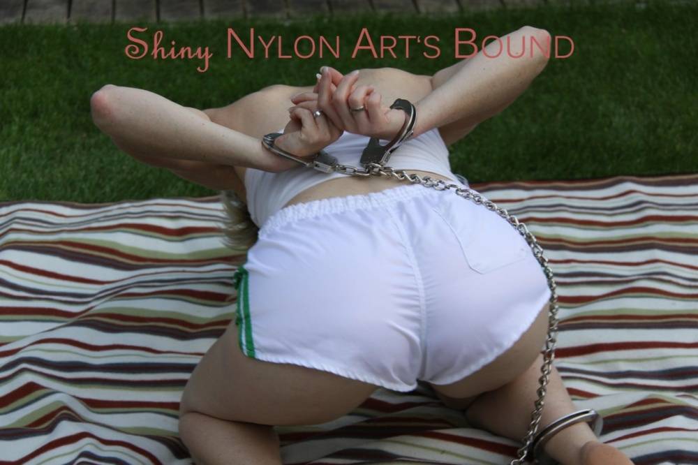 Watching Sonja wearing a hot white shiny nylon shorts and a white top bound | Photo: 834000