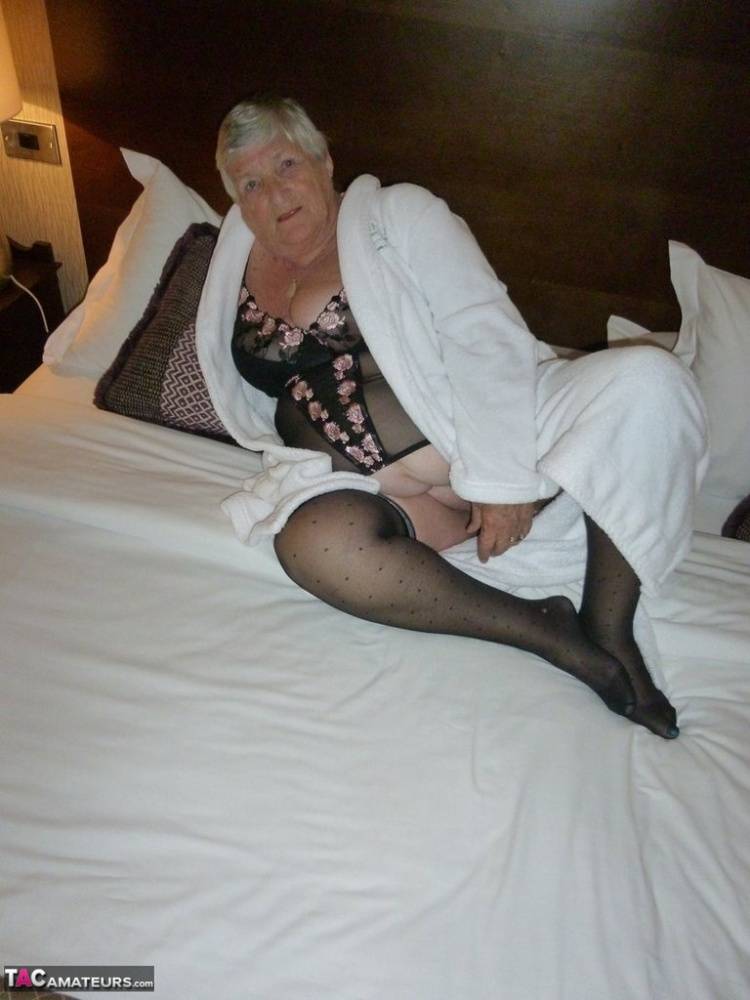 Old woman Grandma Libby displays her fat figure on a bed in sheer stockings - #12