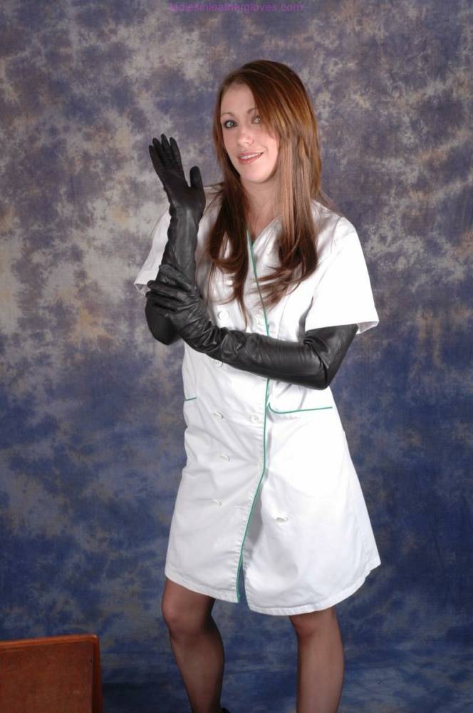 Gorgeous Nurse Sophie shows off her long sexy stockinged legs and long black | Photo: 871784