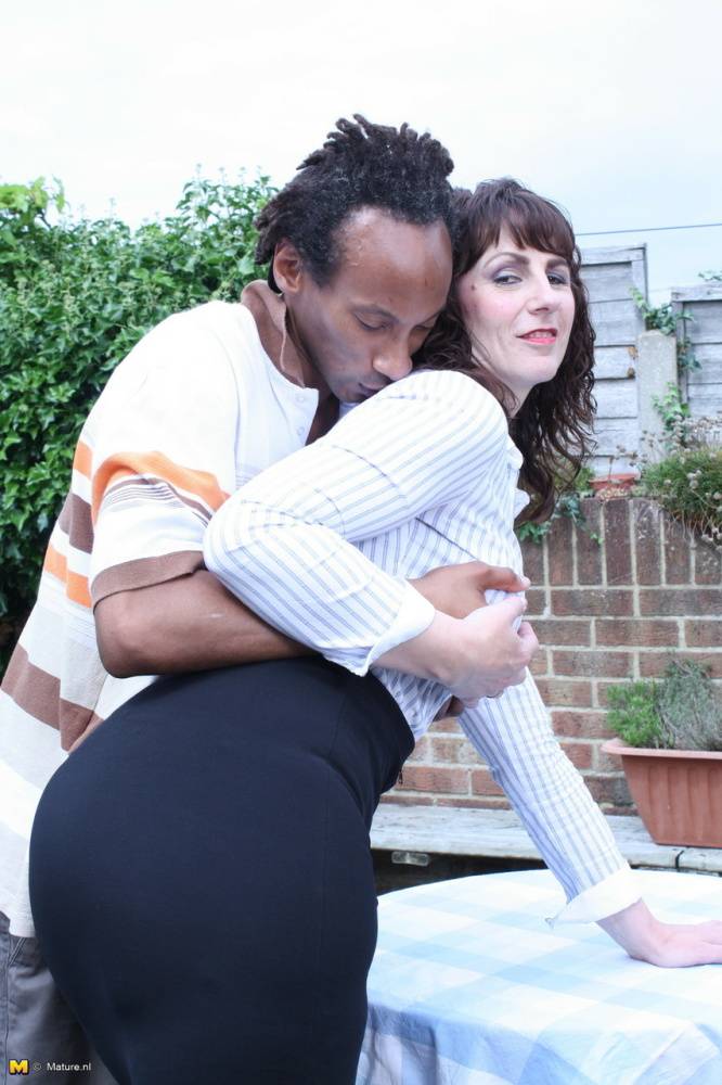 Cheating UK housewife seduces a black man in a black skirt on patio - #3