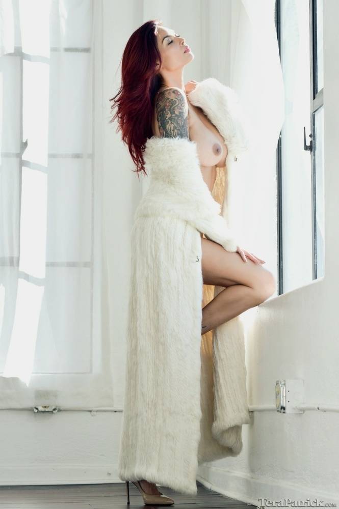 Beautiful Asian woman Tera Patrick removes a white fur coat to pose nude - #4