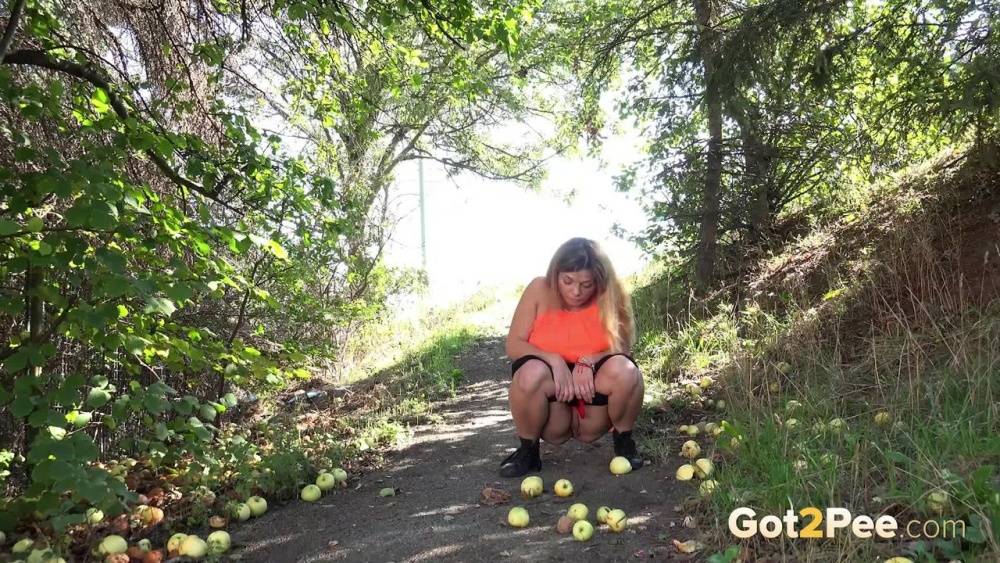 White girl Loreen exposes her bald twat while squatting for a pee in the woods - #9