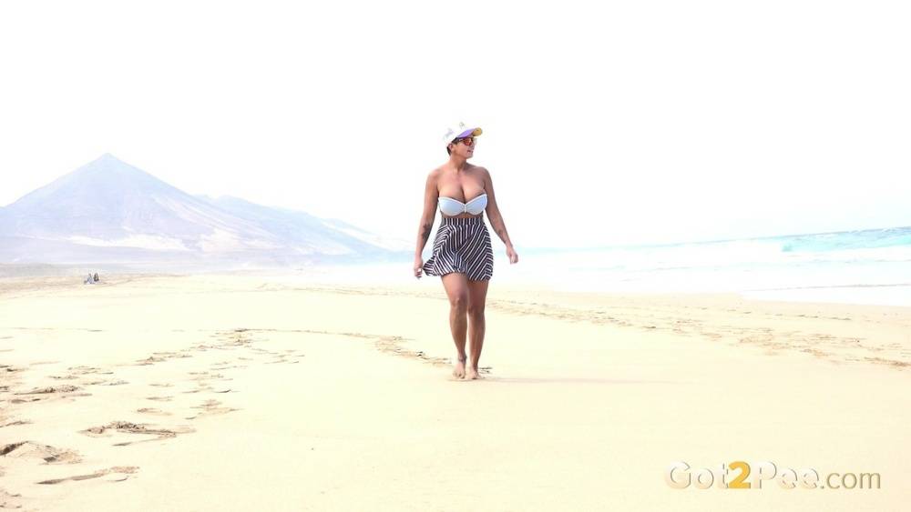 Caucasian female Chloe takes a piss while while traipsing on a deserted beach - #11