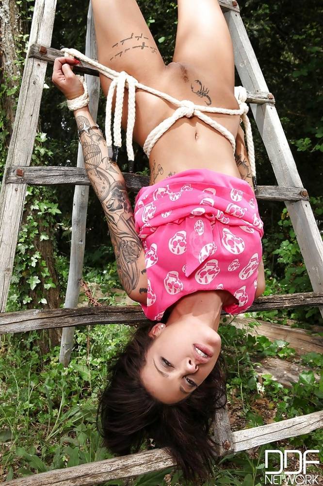 Brunette milf Nikita Bellucci is showing off outdoor in her pink dress - #9