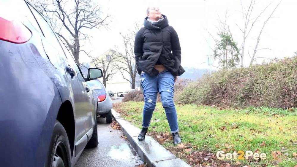 Blonde chick Nikki Dream squats for a pee behind vehicles on a road - #5