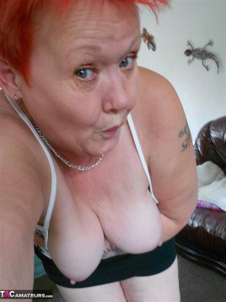 Older redhead Valgasmic Exposedabres her tits and twat while taking selfies - #1