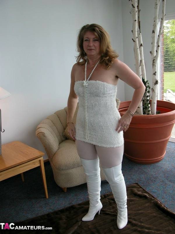Mature fatty shows off her snatch in crotchless hose and over the knee boots - #3