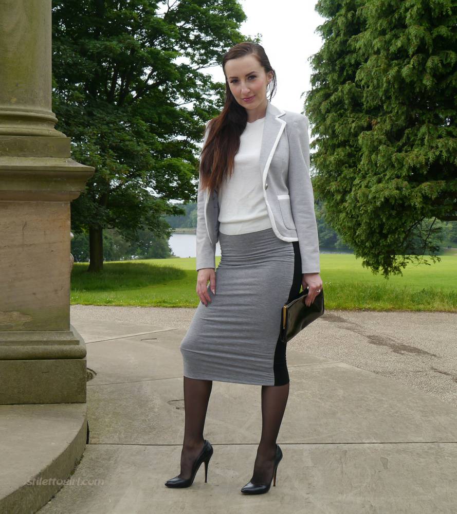 Clothed woman Sophia descends park steps in a long skirt and stiletto heels - #12