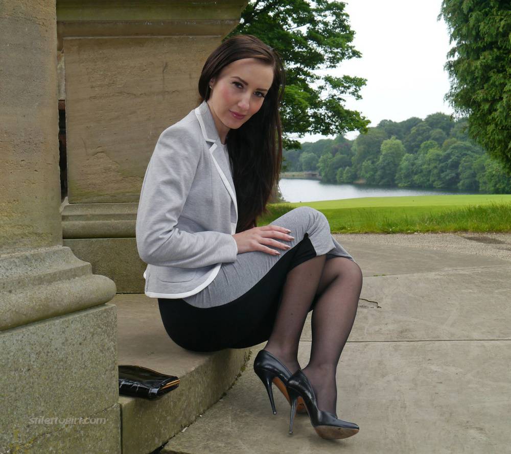 Clothed woman Sophia descends park steps in a long skirt and stiletto heels - #4