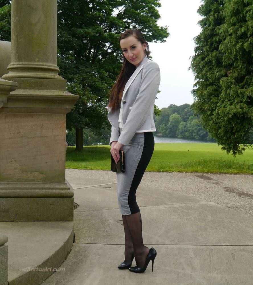 Clothed woman Sophia descends park steps in a long skirt and stiletto heels - #16
