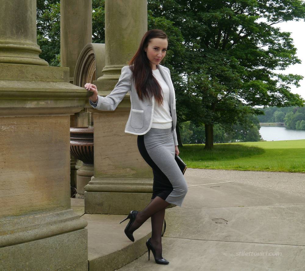 Clothed woman Sophia descends park steps in a long skirt and stiletto heels - #7