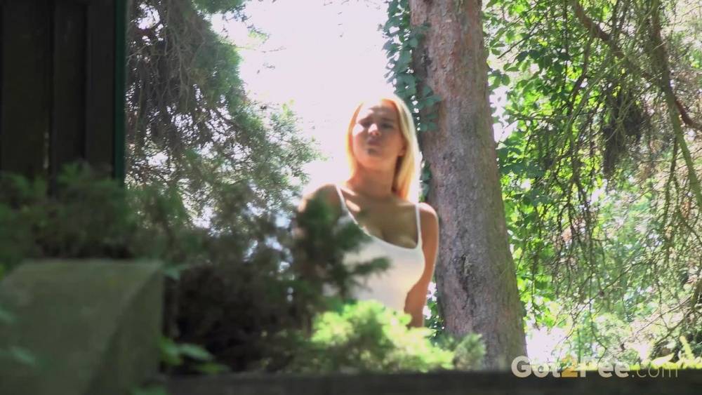 Blonde Nikki Dream in short skirt spreading legs and pissing in the forest - #15