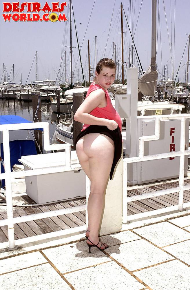 Plump pornstar Desirae flashing her huge tits and upskirt pussy on boat dock - #9