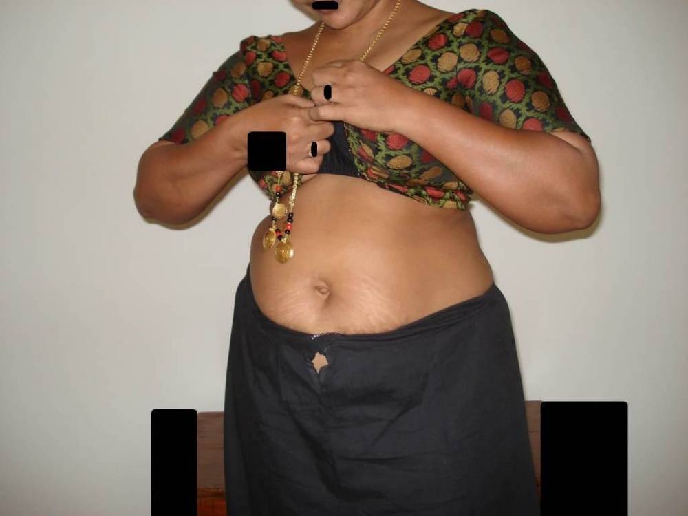 Overweight Indian housewife sports a braided ponytail while getting naked - #8