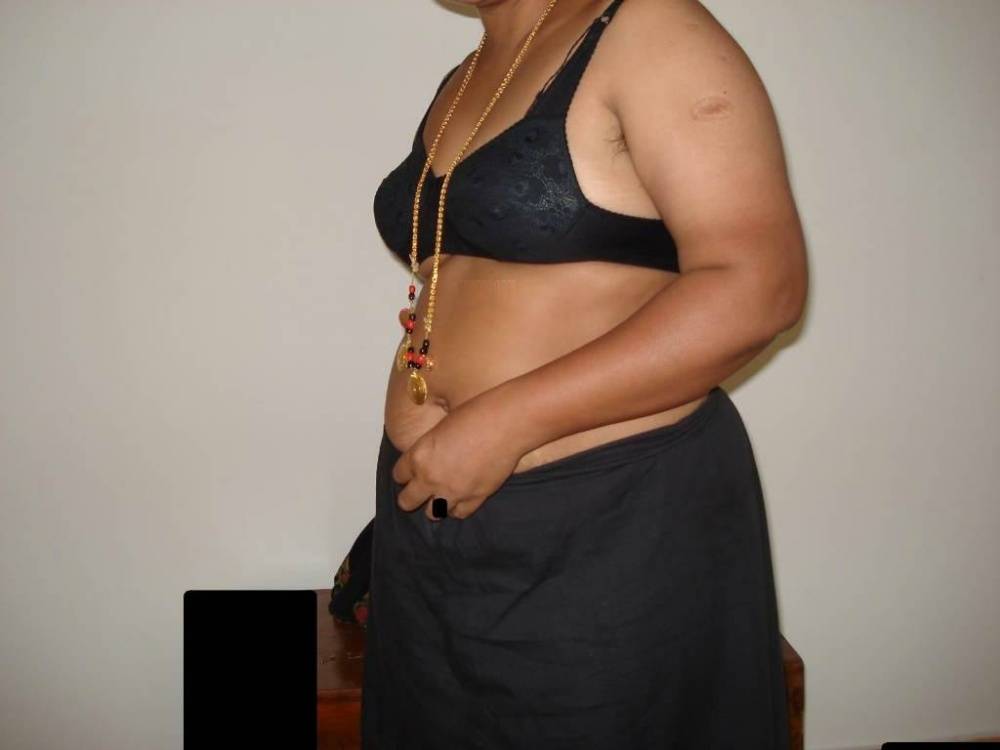 Overweight Indian housewife sports a braided ponytail while getting naked - #9