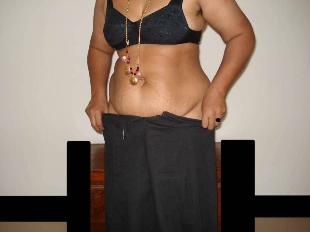 Overweight Indian housewife sports a braided ponytail while getting naked - #2