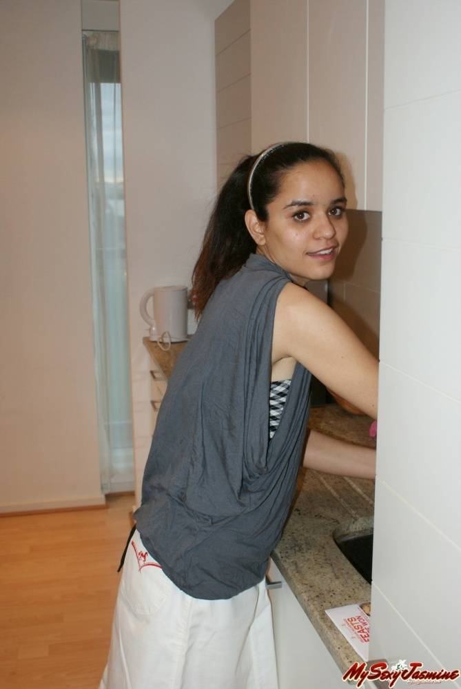 Jasmine in her kitchen exposing while cocking food - #1