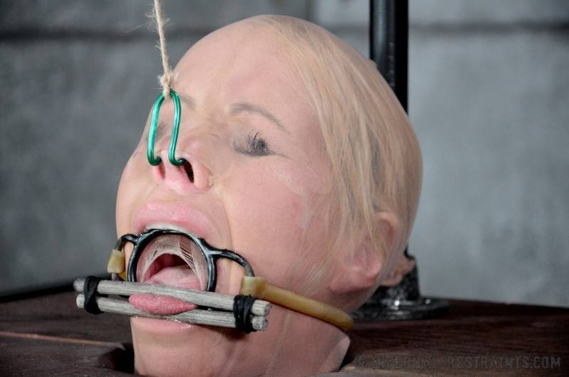 Blonde female Simone Sonay is rendered helpless in a basement dungeon | Photo: 1370112