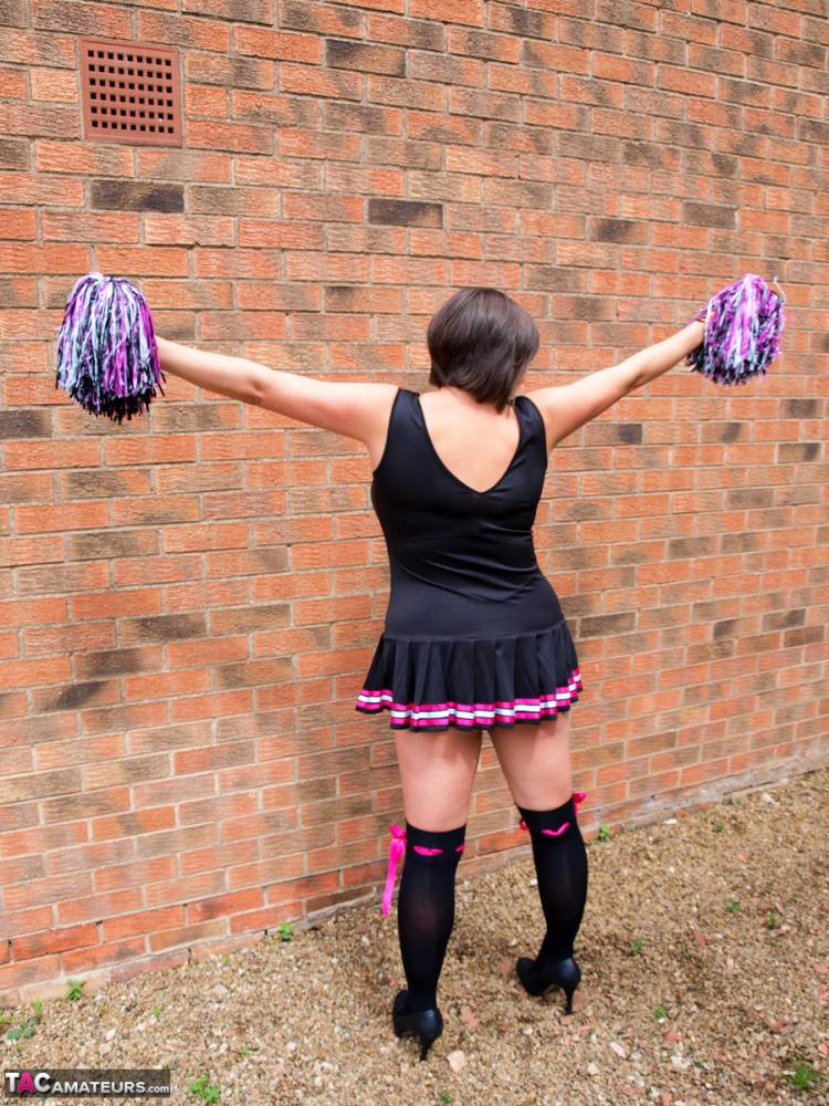 Overweight amateur Roxy doffs a cheerleader uniform in over the knee socks | Photo: 1370542