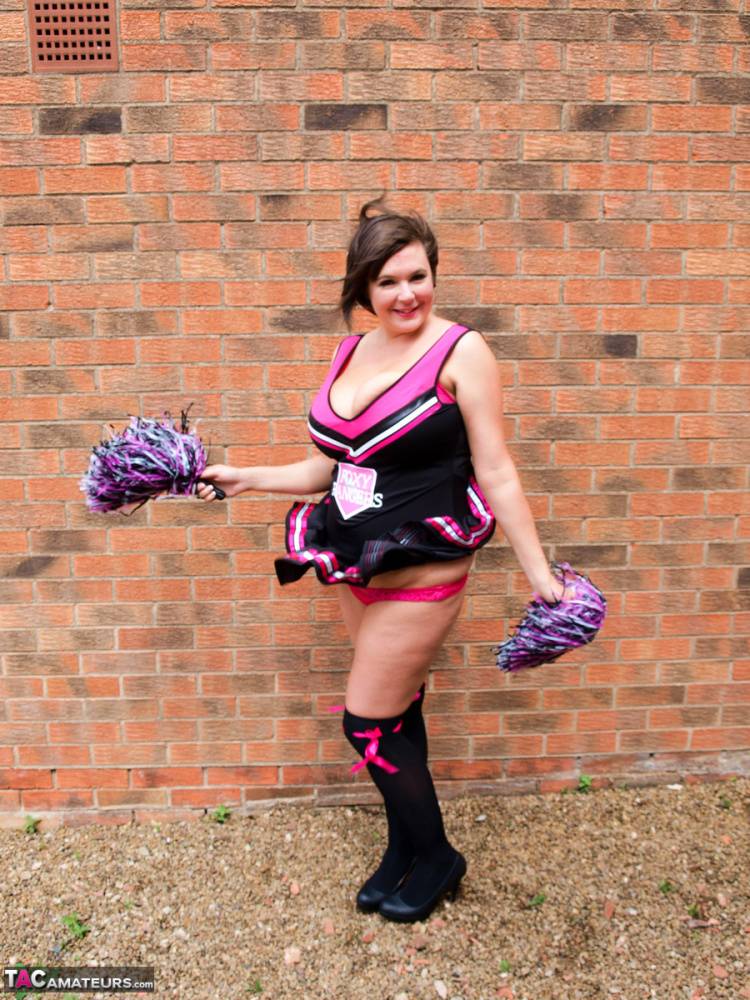 Overweight amateur Roxy doffs a cheerleader uniform in over the knee socks | Photo: 1370532