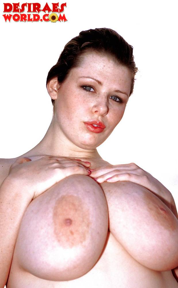 Plump pornstar Desirae demonstrating massive saggy boobs outdoors on beach - #15