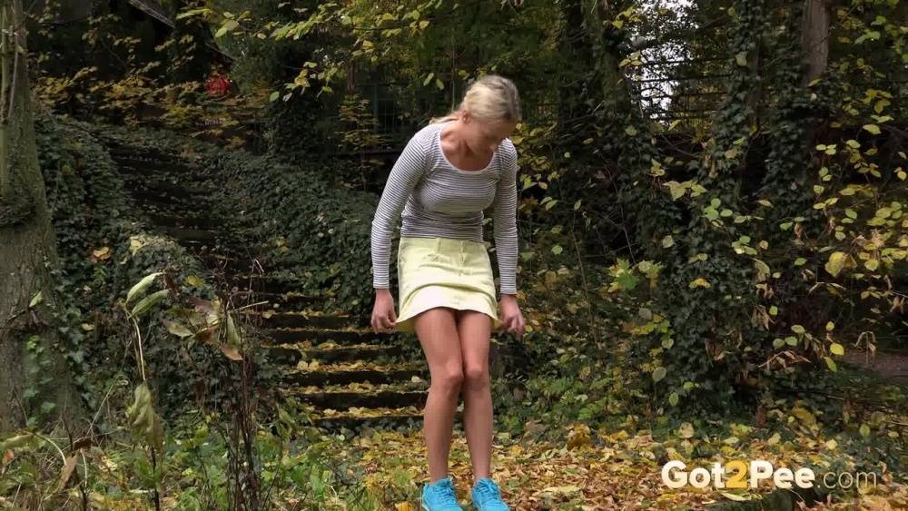 Cute blonde Victoria Pure hikes her skirt to take a pee along country lane | Photo: 1411800